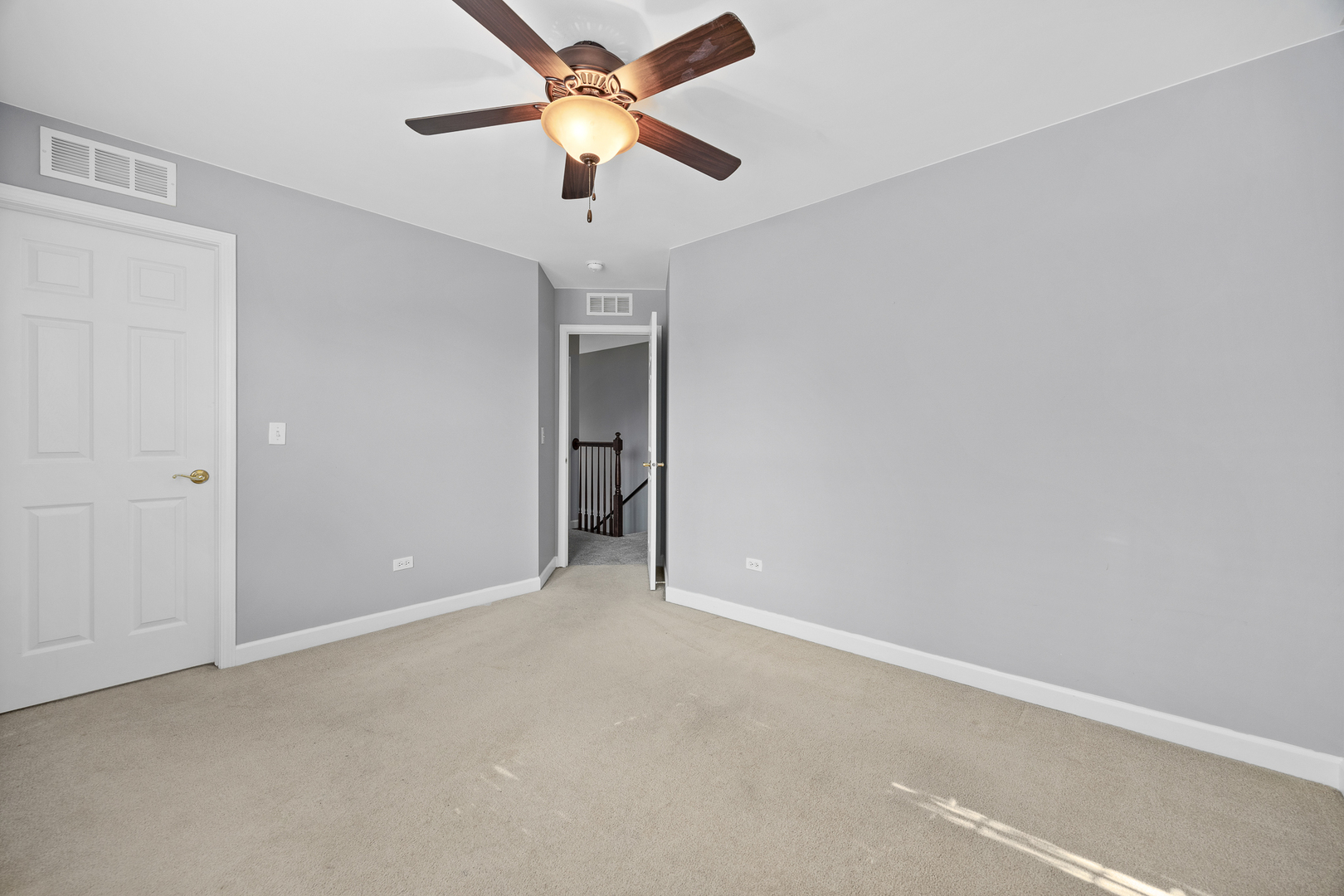 725 Delacourte Avenue Bolingbrook, IL 60490 - Photo 25 of 38 an empty room with closet and a chandelier fan