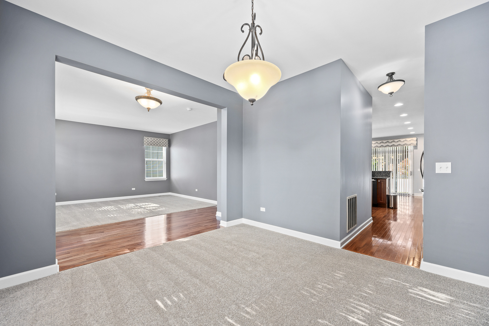 725 Delacourte Avenue Bolingbrook, IL 60490 - Photo 6 of 38 a bedroom with a bed and a chandelier