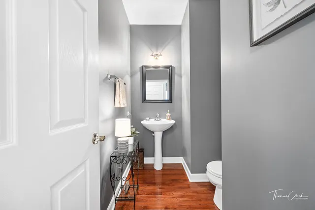 a view of a bathroom with a sink and a mirror