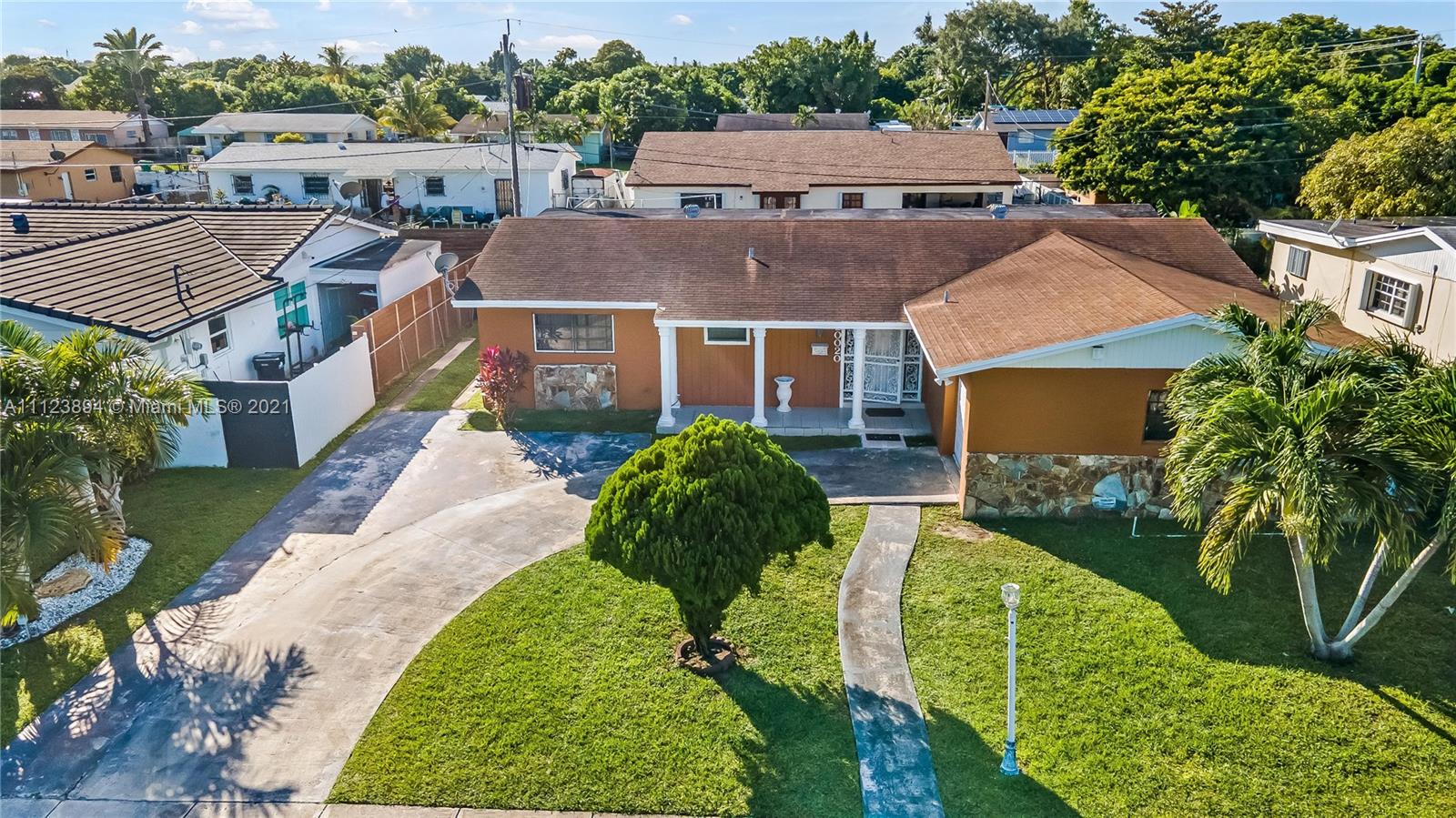 20020 Southwest 112th Avenue Miami, FL 33189 - Photo 2 of 39 a aerial view of a house with a yard and potted plants