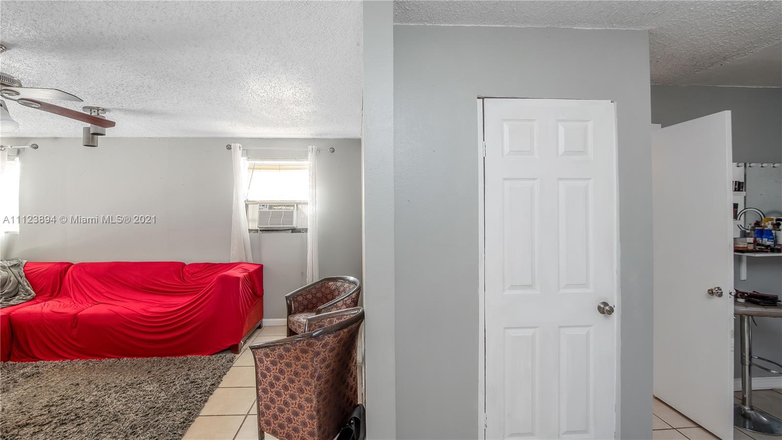 20020 Southwest 112th Avenue Miami, FL 33189 - Photo 15 of 39 a picture of a room with a couch