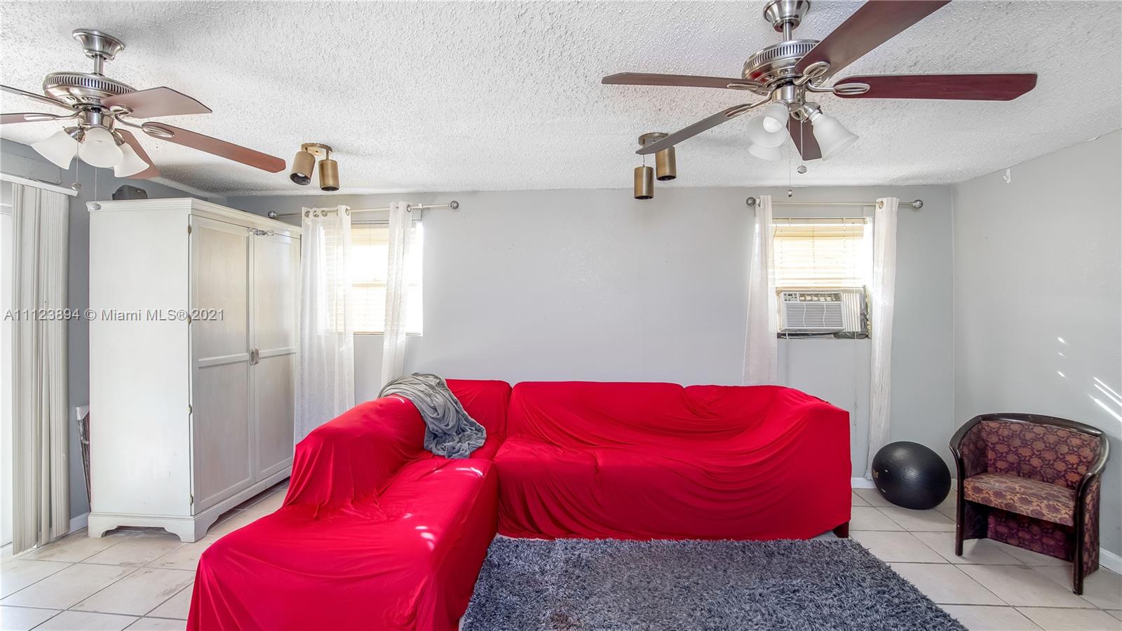 20020 Southwest 112th Avenue Miami, FL 33189 - Photo 21 of 39 a bedroom with a bed and a window