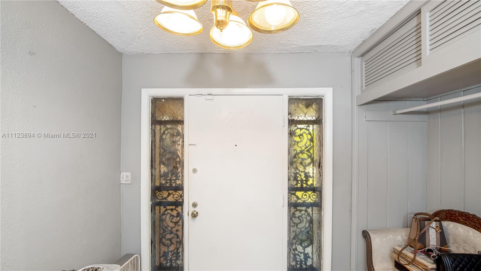 20020 Southwest 112th Avenue Miami, FL 33189 - Photo 24 of 39 a view of hallway with mirror