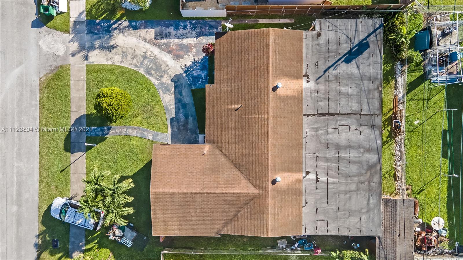 20020 Southwest 112th Avenue Miami, FL 33189 - Photo 39 of 39 aerial view of a house with a yard and potted plants