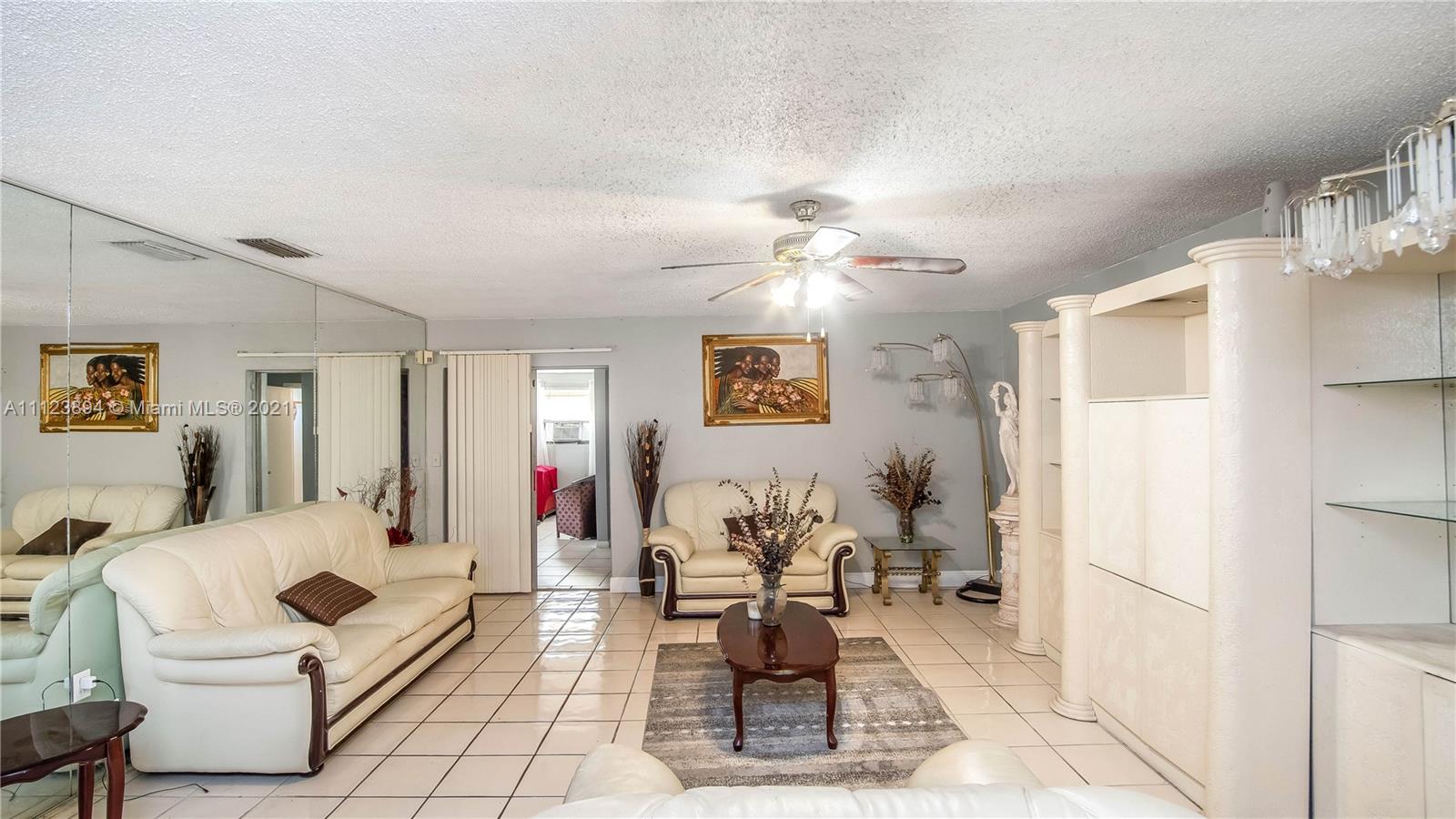 20020 Southwest 112th Avenue Miami, FL 33189 - Photo 5 of 39 a living room with furniture and wooden floor