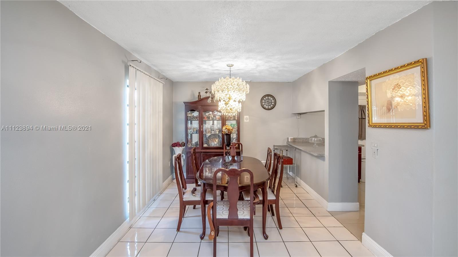 20020 Southwest 112th Avenue Miami, FL 33189 - Photo 9 of 39 a view of a dining room with furniture and window