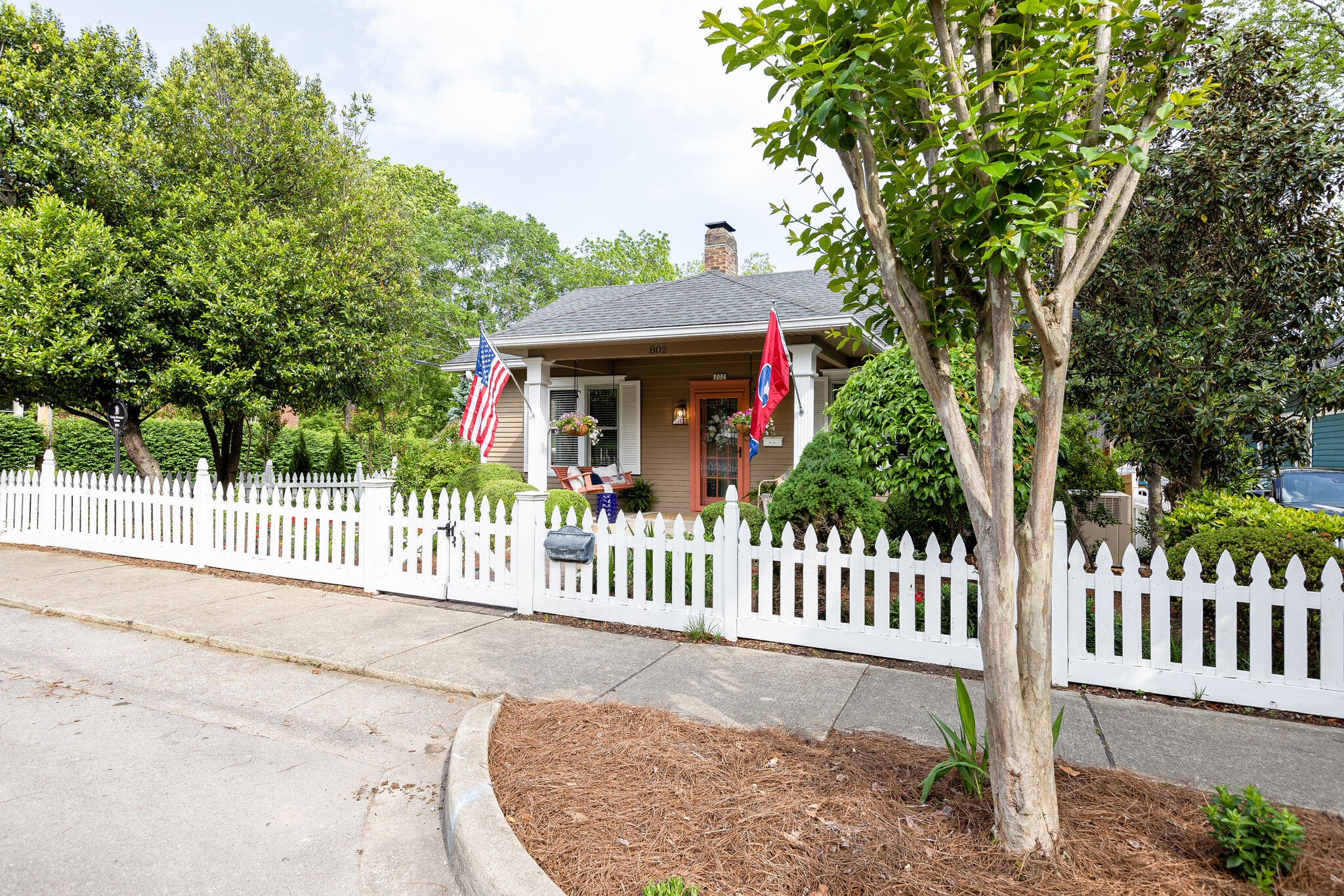 802 Fair Street Franklin, TN 37064 - Photo 4 of 70 a front view of a house with a garden
