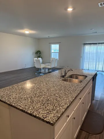 a kitchen with a sink and counter space