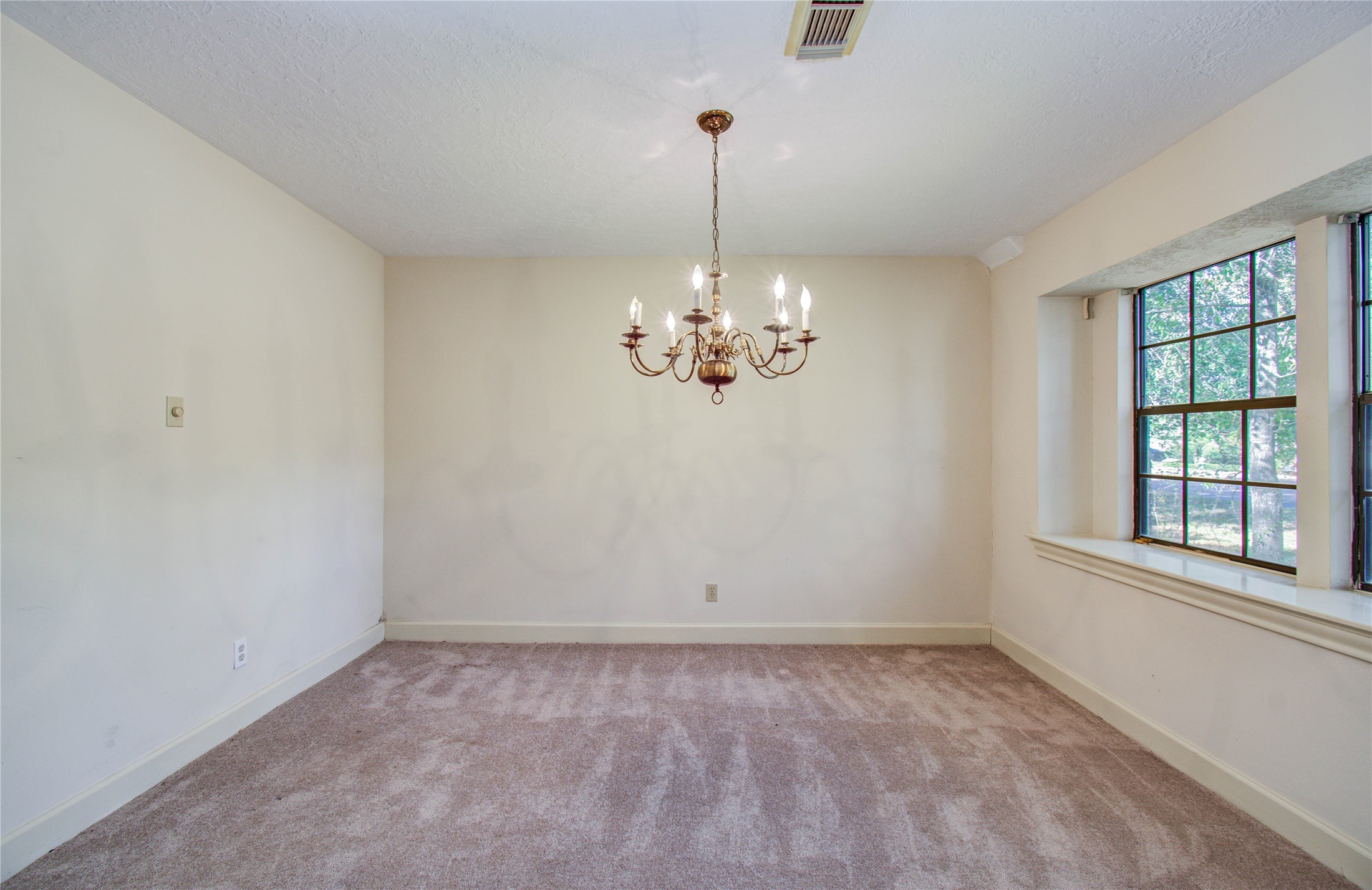 10715 East Timberwagon Circle Spring, TX 77380 - Photo 12 of 50 a view of a chandelier in big room and chandelier fan