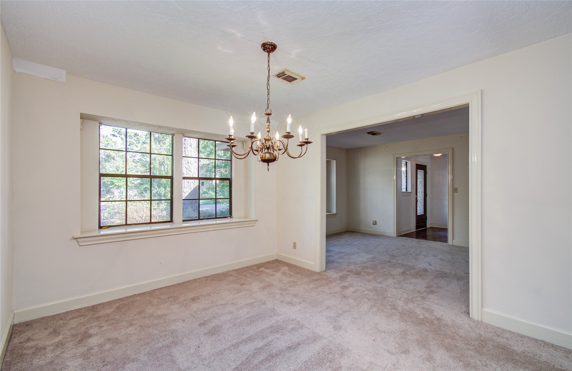 10715 East Timberwagon Circle Spring, TX 77380 - Photo 14 of 50 wooden floor in an empty room with a window