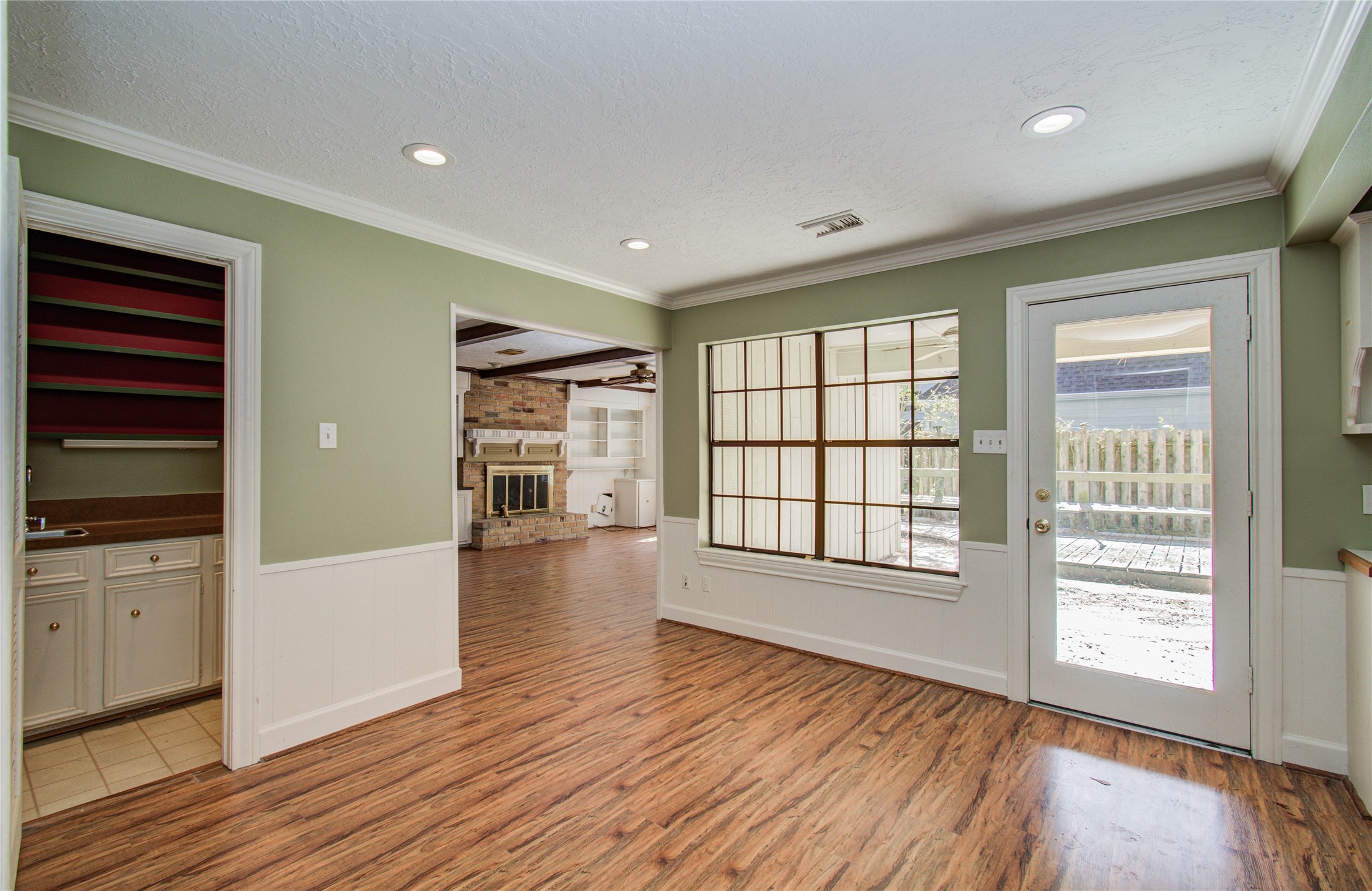 10715 East Timberwagon Circle Spring, TX 77380 - Photo 15 of 50 wooden floor in an empty room with a window