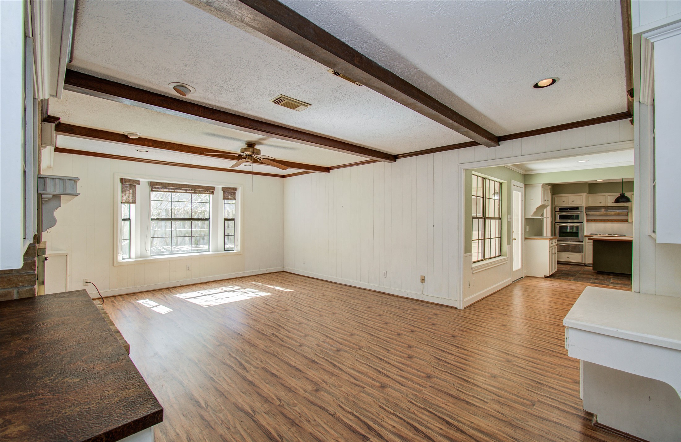 10715 East Timberwagon Circle Spring, TX 77380 - Photo 30 of 50 a view of an empty room with wooden floor and a window