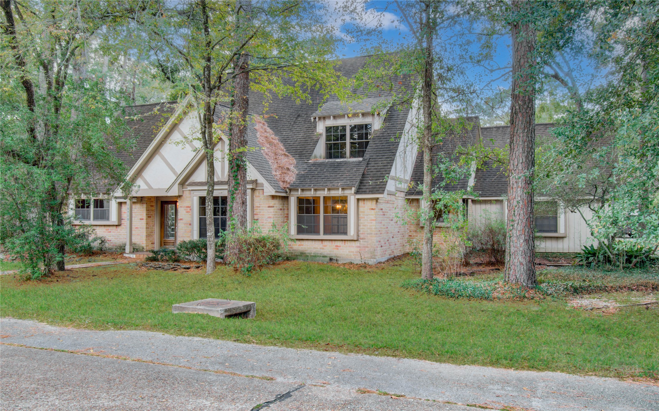10715 East Timberwagon Circle Spring, TX 77380 - Photo 3 of 50 front view of house with a yard
