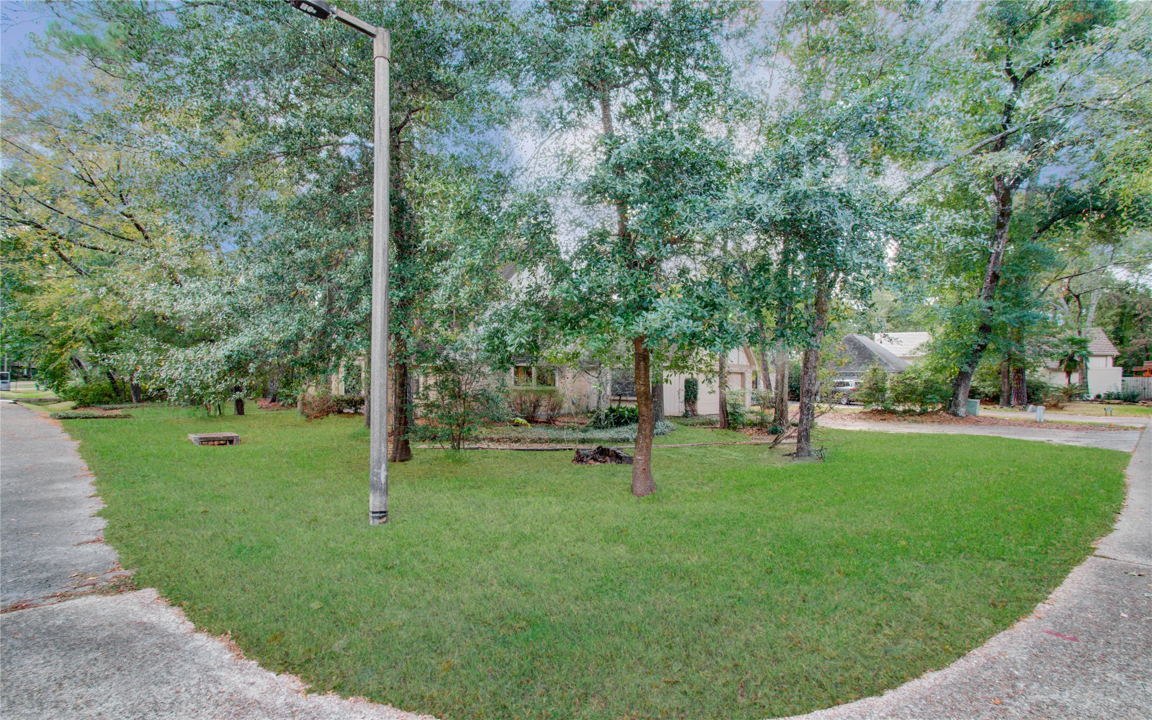 10715 East Timberwagon Circle Spring, TX 77380 - Photo 4 of 50 a view of a backyard with large trees