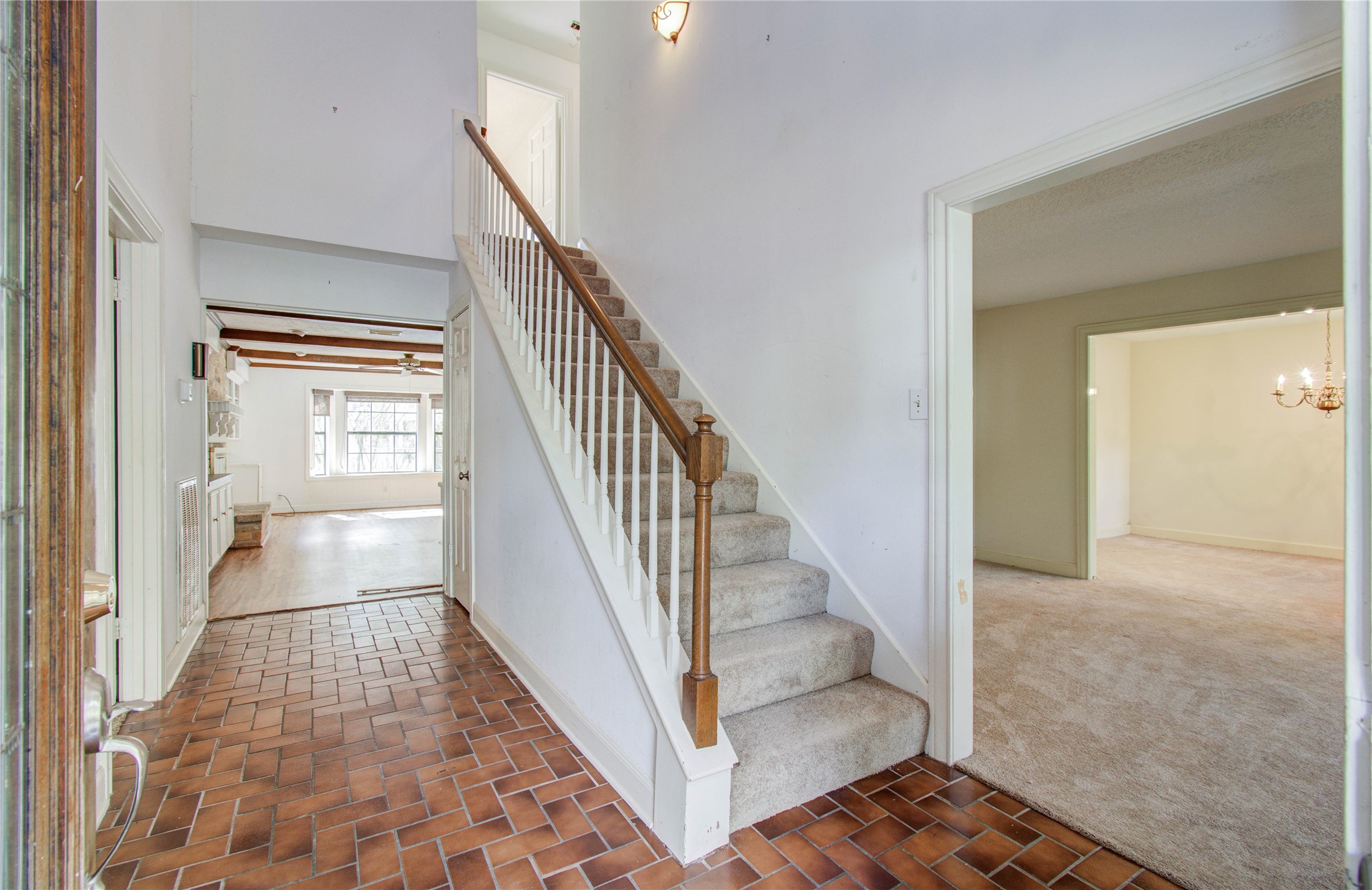 10715 East Timberwagon Circle Spring, TX 77380 - Photo 7 of 50 a view of staircase with white walls and a rug