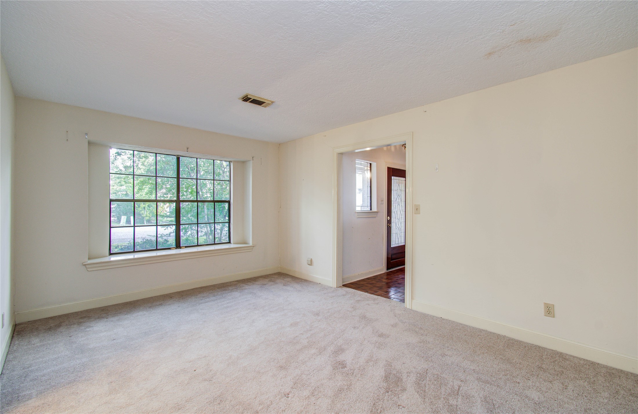 10715 East Timberwagon Circle Spring, TX 77380 - Photo 9 of 50 an empty room with windows