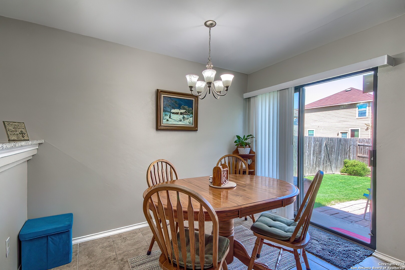 5709 Ping Way Cibolo, TX 78108 - Photo 13 of 28 a view of a dining room with furniture window and wooden floor