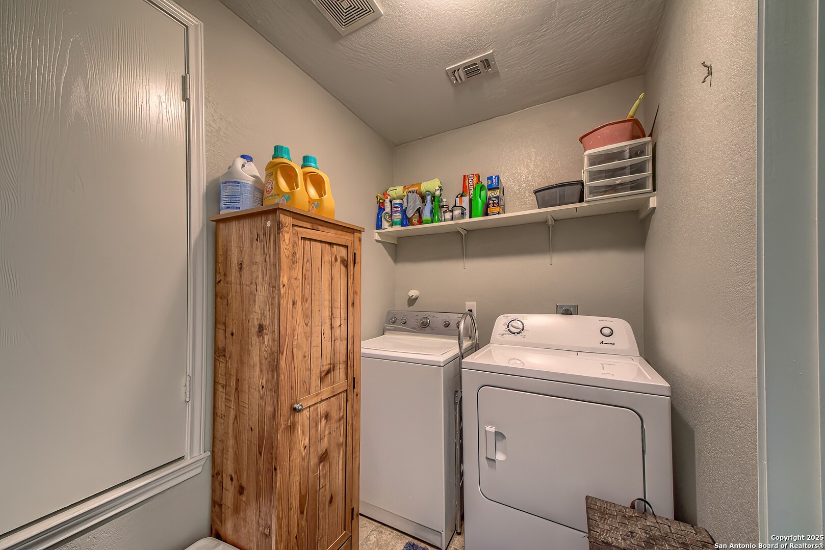 5709 Ping Way Cibolo, TX 78108 - Photo 15 of 28 a utility room with dryer and washer