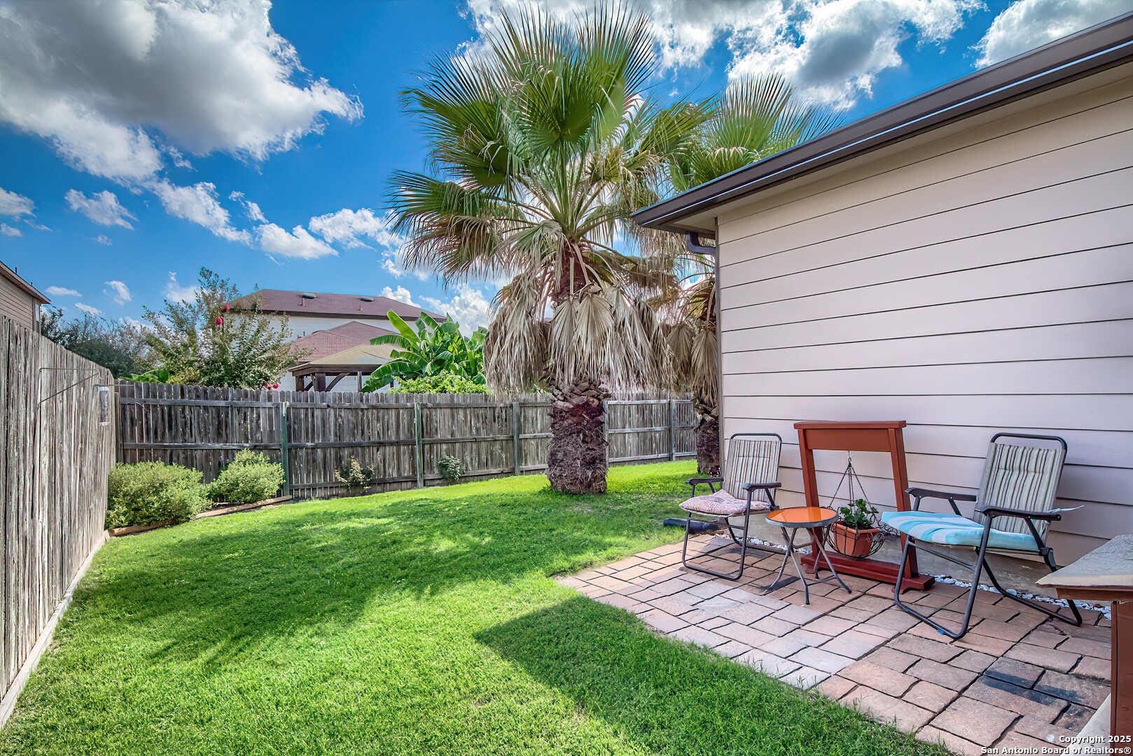 5709 Ping Way Cibolo, TX 78108 - Photo 26 of 28 a view of a backyard with a sitting area and slide