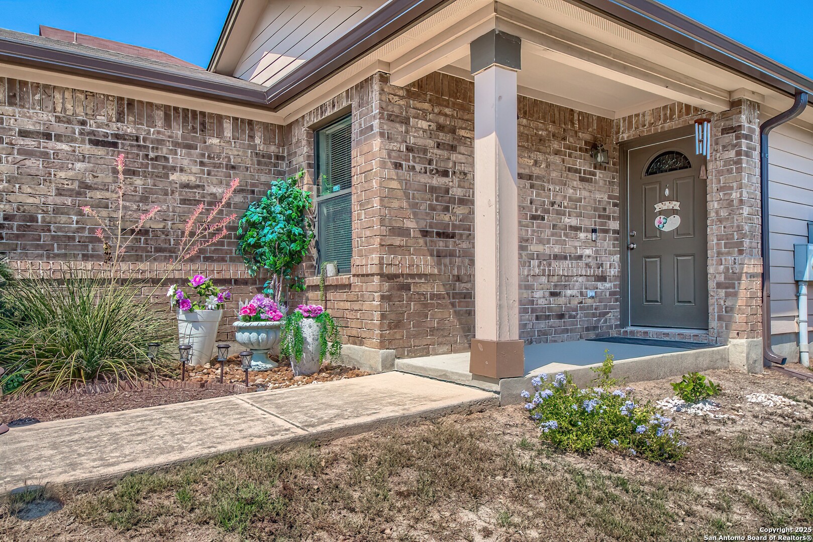 5709 Ping Way Cibolo, TX 78108 - Photo 3 of 28 a view of a house with potted plants