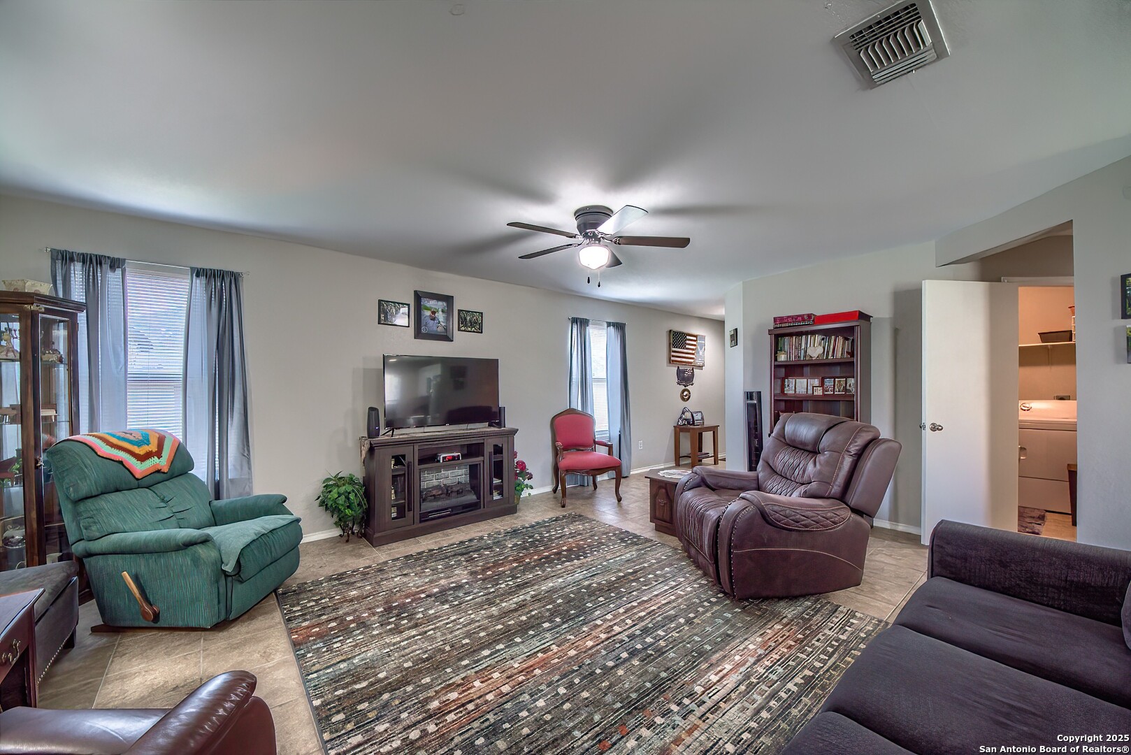 5709 Ping Way Cibolo, TX 78108 - Photo 6 of 28 a living room with furniture and a flat screen tv