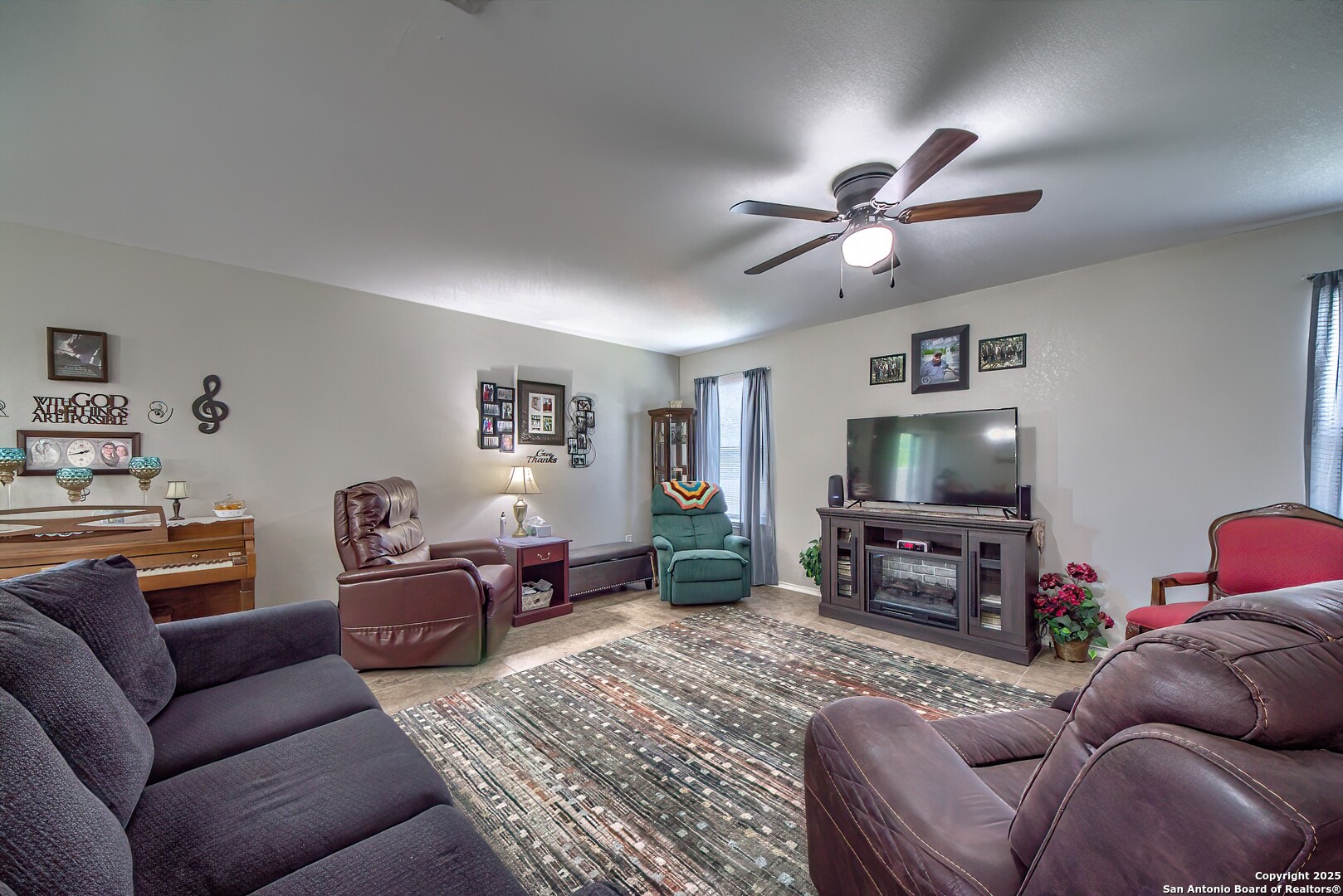 5709 Ping Way Cibolo, TX 78108 - Photo 7 of 28 a living room with furniture a flat screen tv and a window