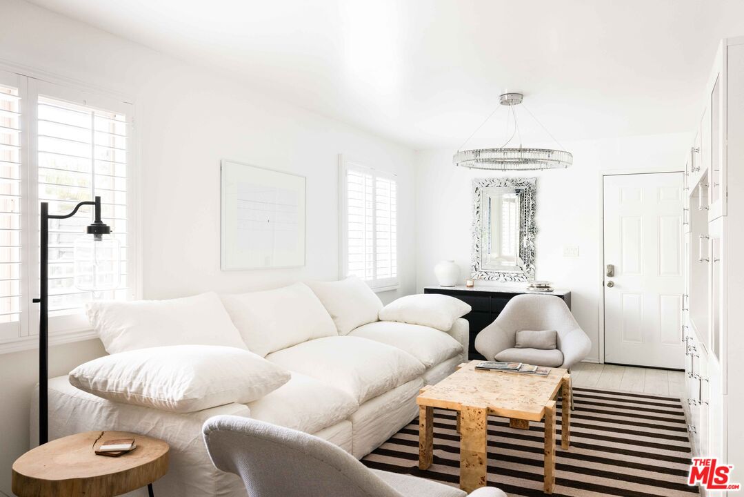 9809 Beeson Drive, Unit C Beverly Hills, CA 90210 - Photo 2 of 7 a living room with furniture and a large window
