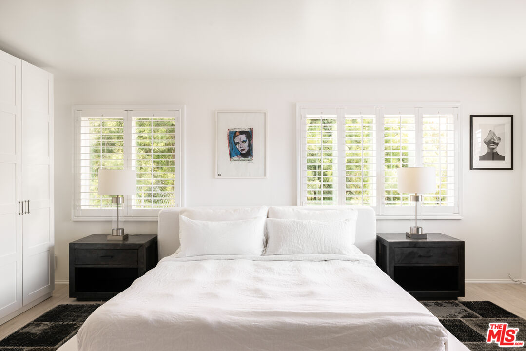 9809 Beeson Drive, Unit C Beverly Hills, CA 90210 - Photo 5 of 7 a bedroom with a bed and a window