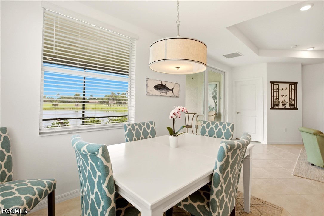 3751 Pebblebrook Ridge Court, Unit 101 Fort Myers, FL 33905 - Photo 18 of 48 a view of a dining room with furniture and window