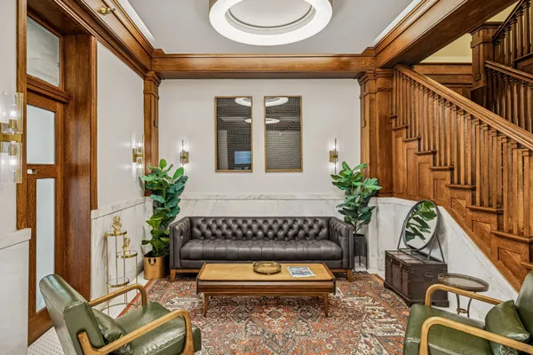 a view of a house with a chairs in patio