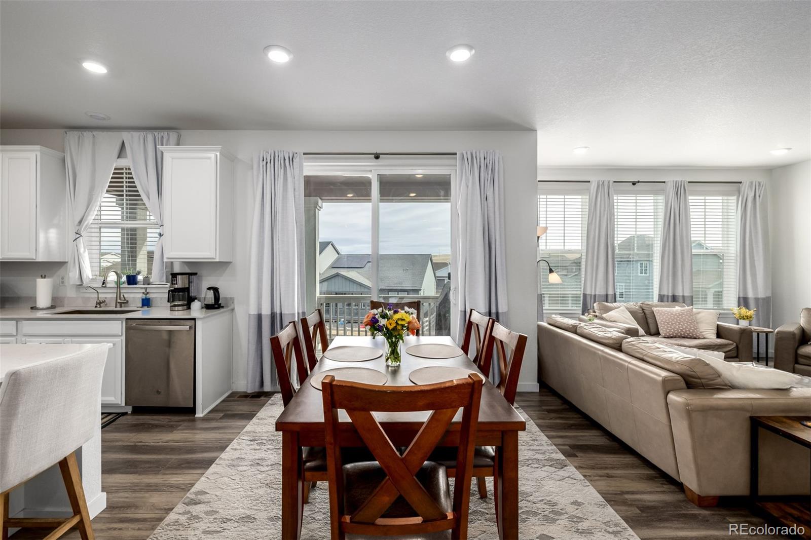 8184 Mt Lincoln Road Littleton, CO 80125 - Photo 11 of 46 a dining room with furniture and a large window