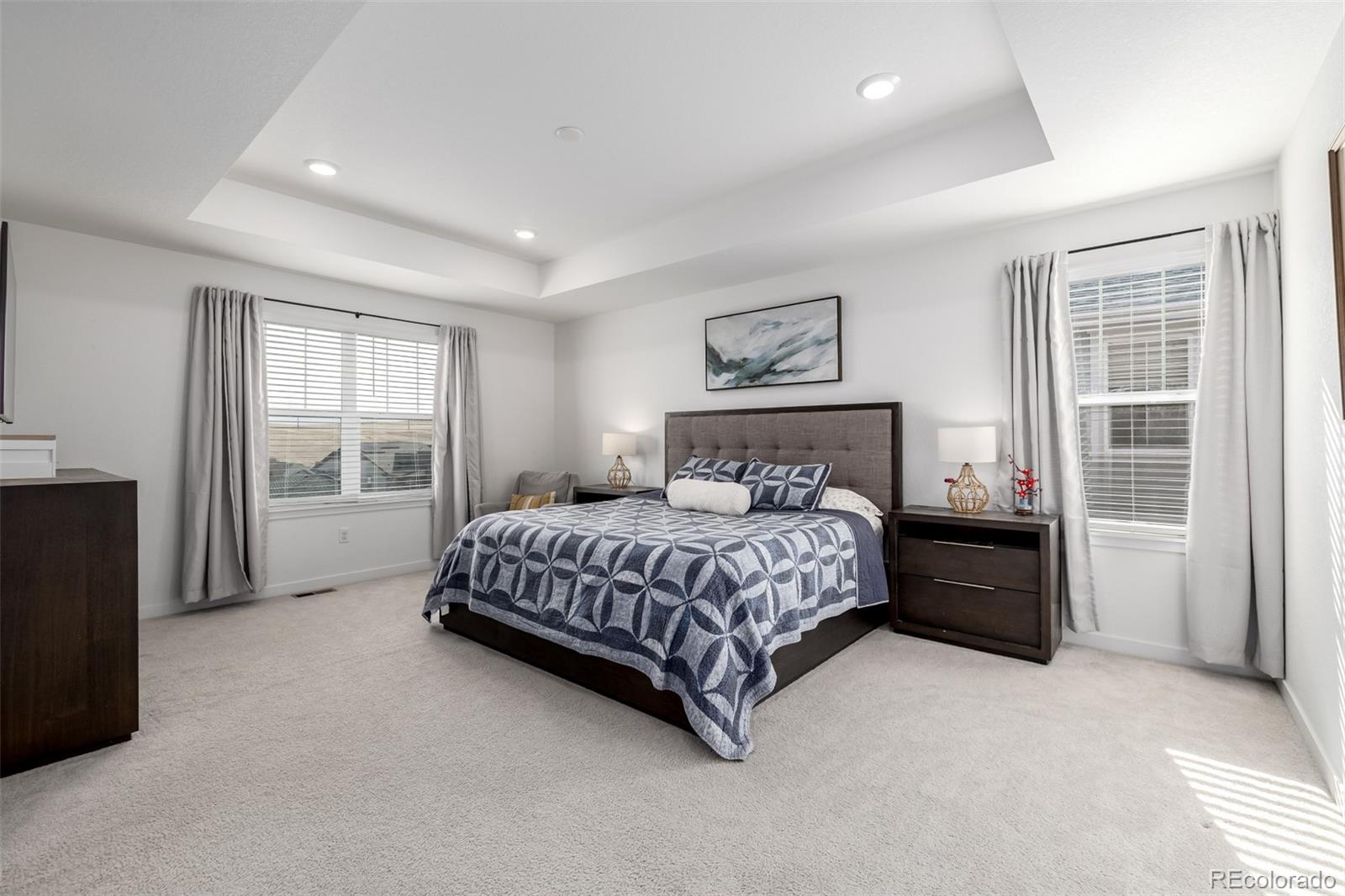 8184 Mt Lincoln Road Littleton, CO 80125 - Photo 19 of 46 a bedroom with a large bed and a window