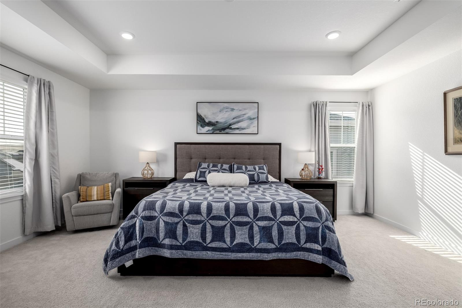 8184 Mt Lincoln Road Littleton, CO 80125 - Photo 20 of 46 a bedroom with a bed and a couch