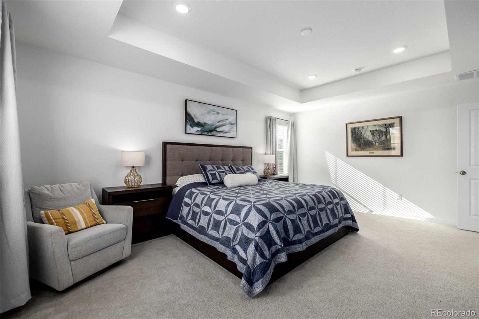 8184 Mt Lincoln Road Littleton, CO 80125 - Photo 22 of 46 a bedroom with a bed and a couch