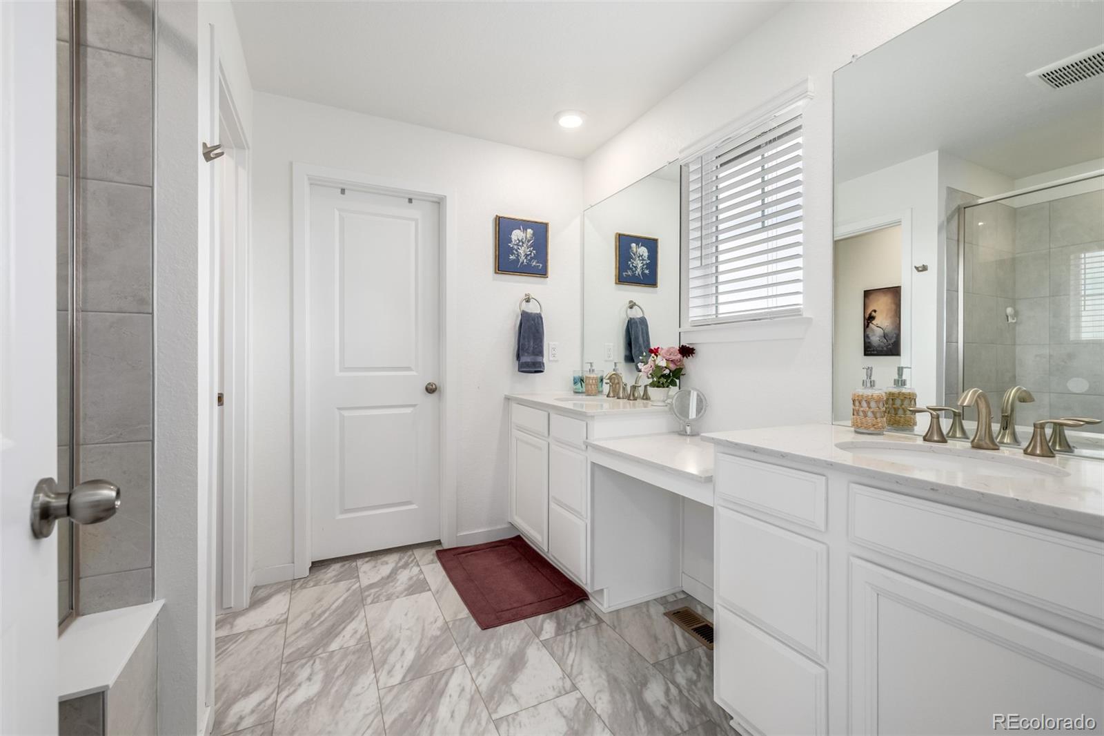 8184 Mt Lincoln Road Littleton, CO 80125 - Photo 23 of 46 a bathroom with a sink and mirror