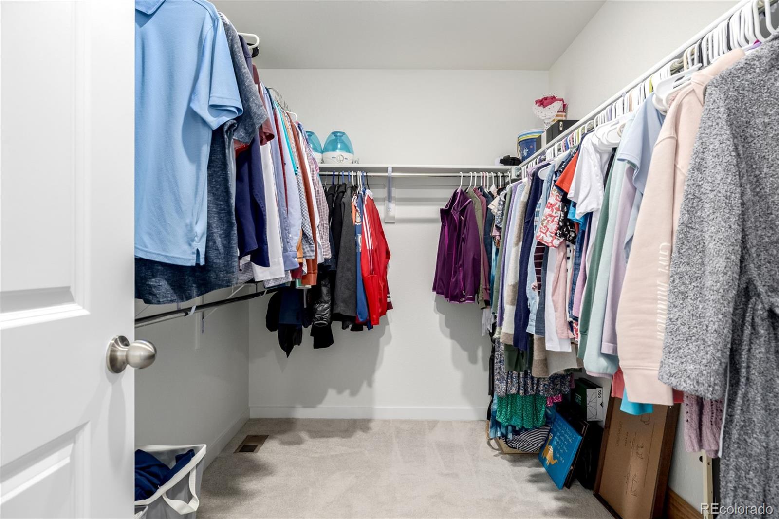 8184 Mt Lincoln Road Littleton, CO 80125 - Photo 25 of 46 a view of walk in closet with clothes