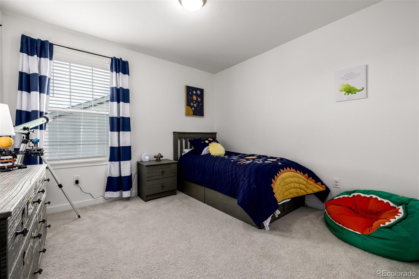 8184 Mt Lincoln Road Littleton, CO 80125 - Photo 26 of 46 a bedroom with a bed and a window