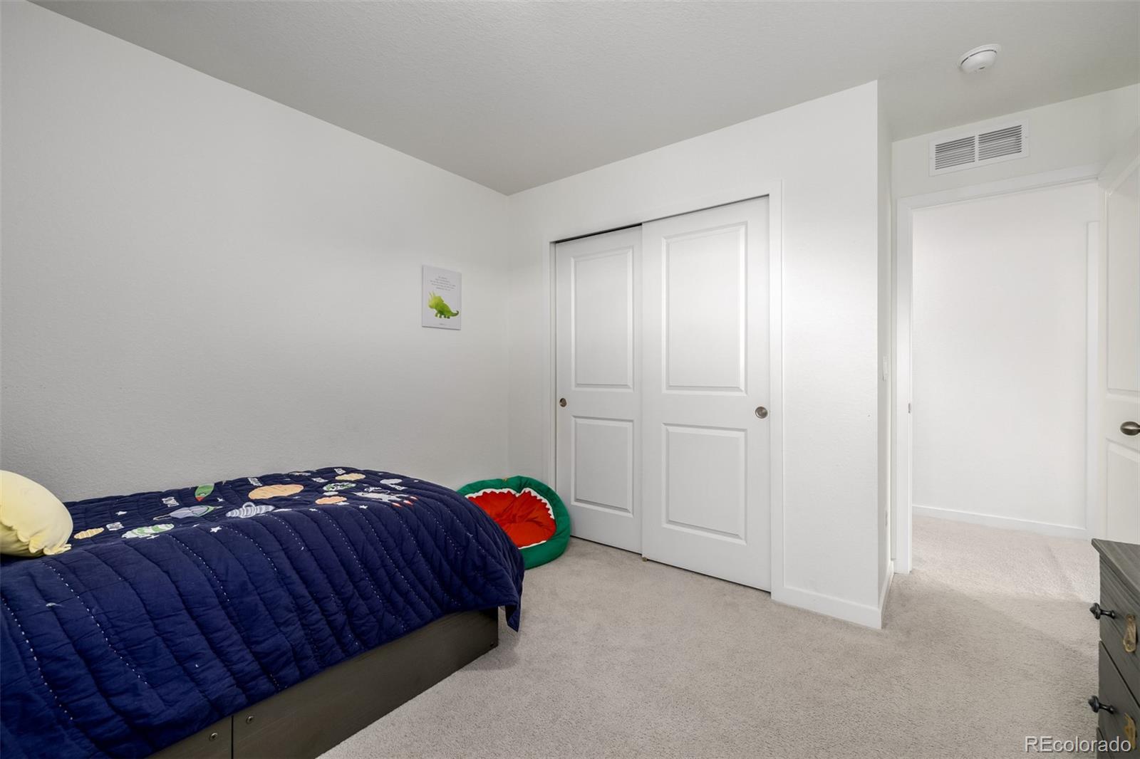 8184 Mt Lincoln Road Littleton, CO 80125 - Photo 27 of 46 a bedroom with a bed and a closet