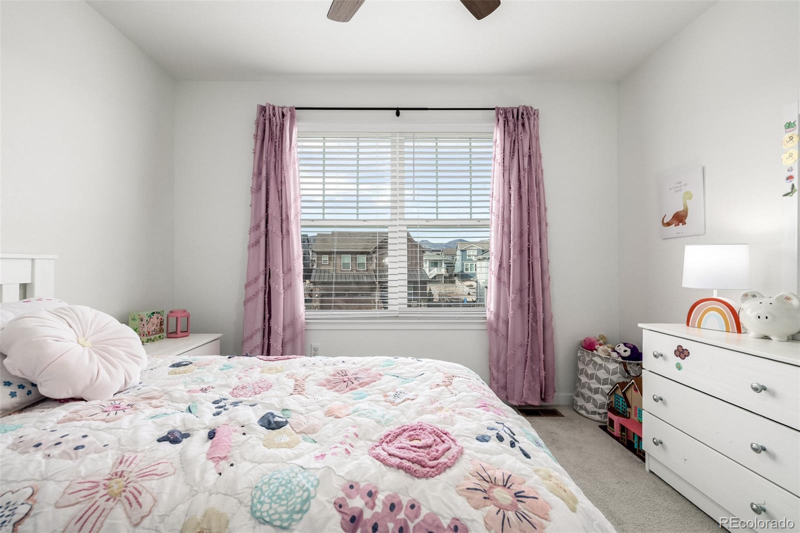 8184 Mt Lincoln Road Littleton, CO 80125 - Photo 29 of 46 a bedroom with a bed and window