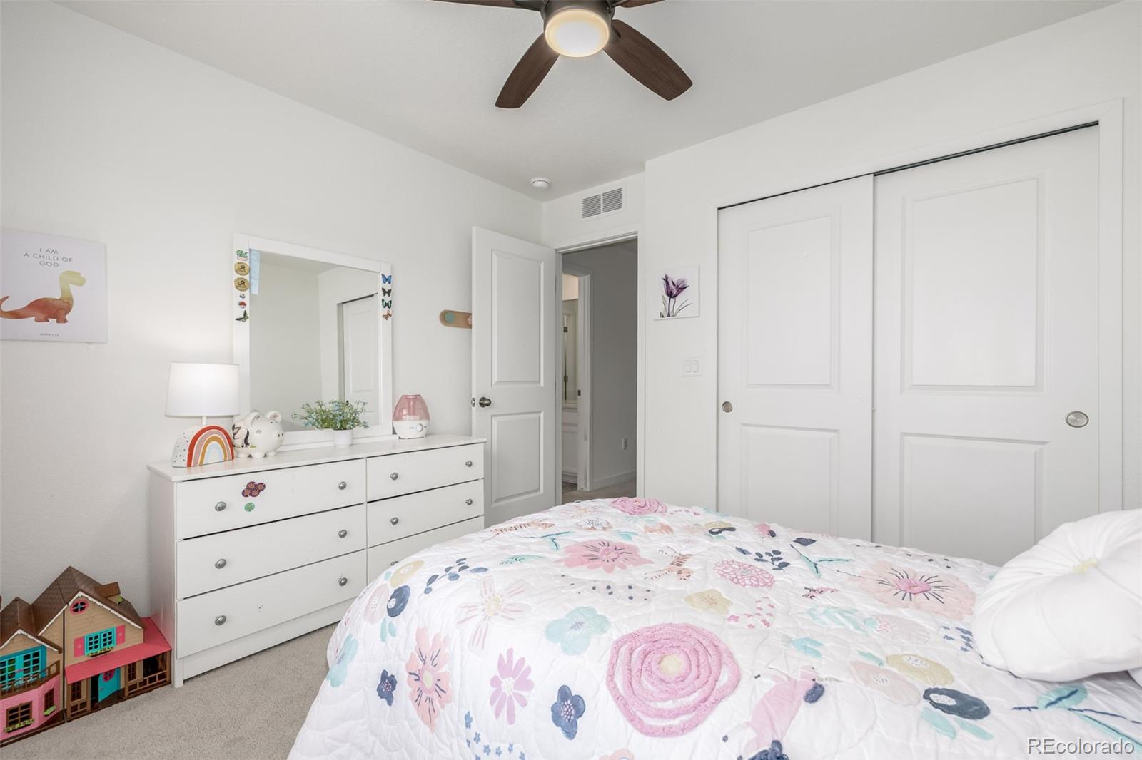 8184 Mt Lincoln Road Littleton, CO 80125 - Photo 30 of 46 a bedroom with a bed and a dresser in it
