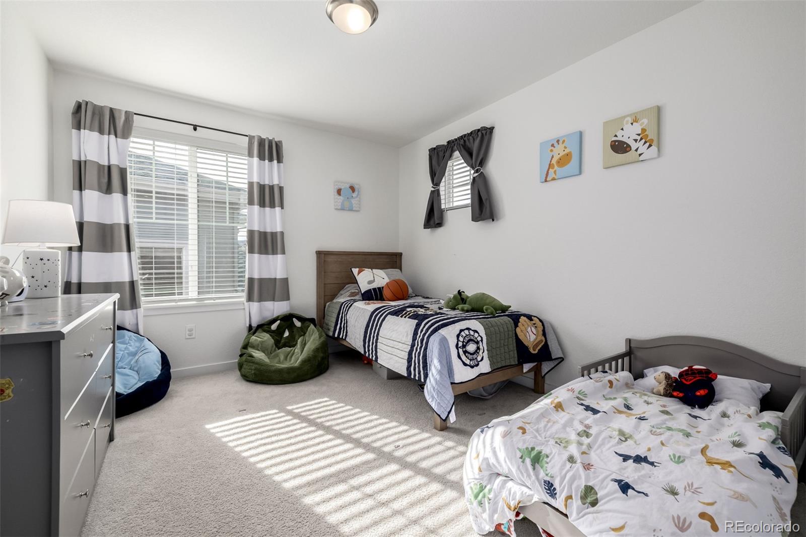 8184 Mt Lincoln Road Littleton, CO 80125 - Photo 31 of 46 a bedroom with two beds and a couch