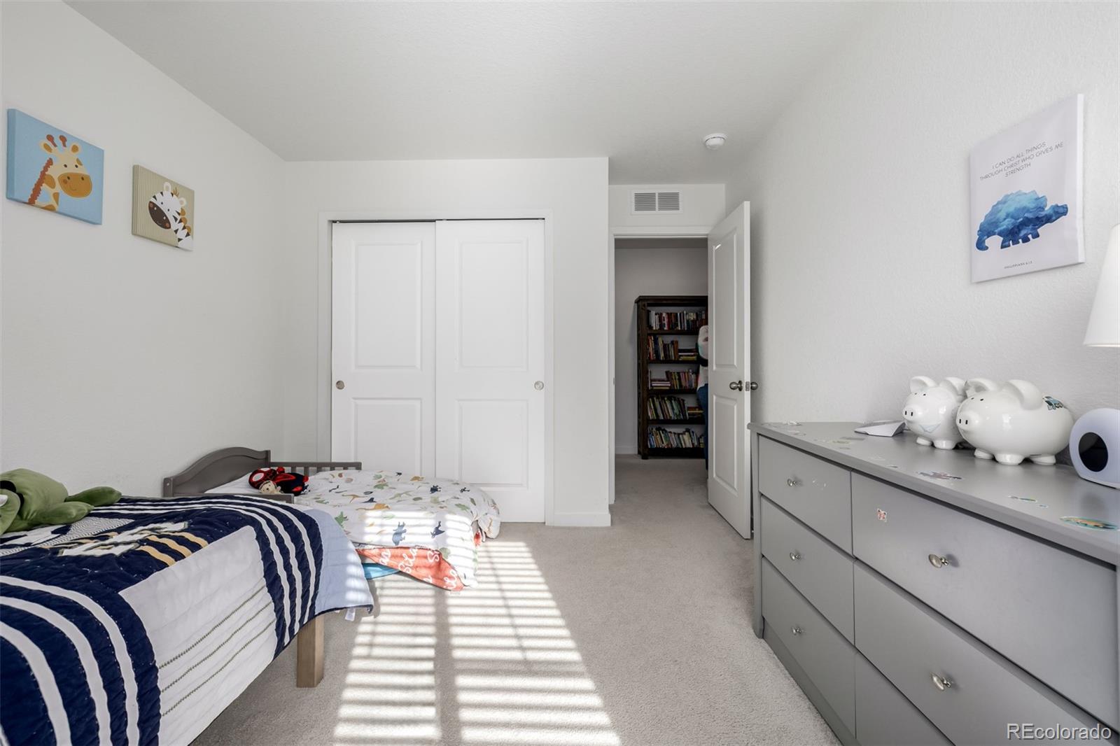 8184 Mt Lincoln Road Littleton, CO 80125 - Photo 32 of 46 a bed room with a bed and a cabinets