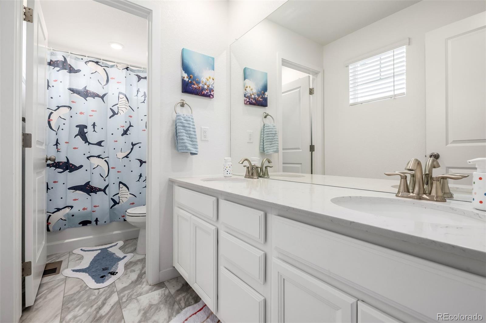 8184 Mt Lincoln Road Littleton, CO 80125 - Photo 33 of 46 a bathroom with a sink and a mirror