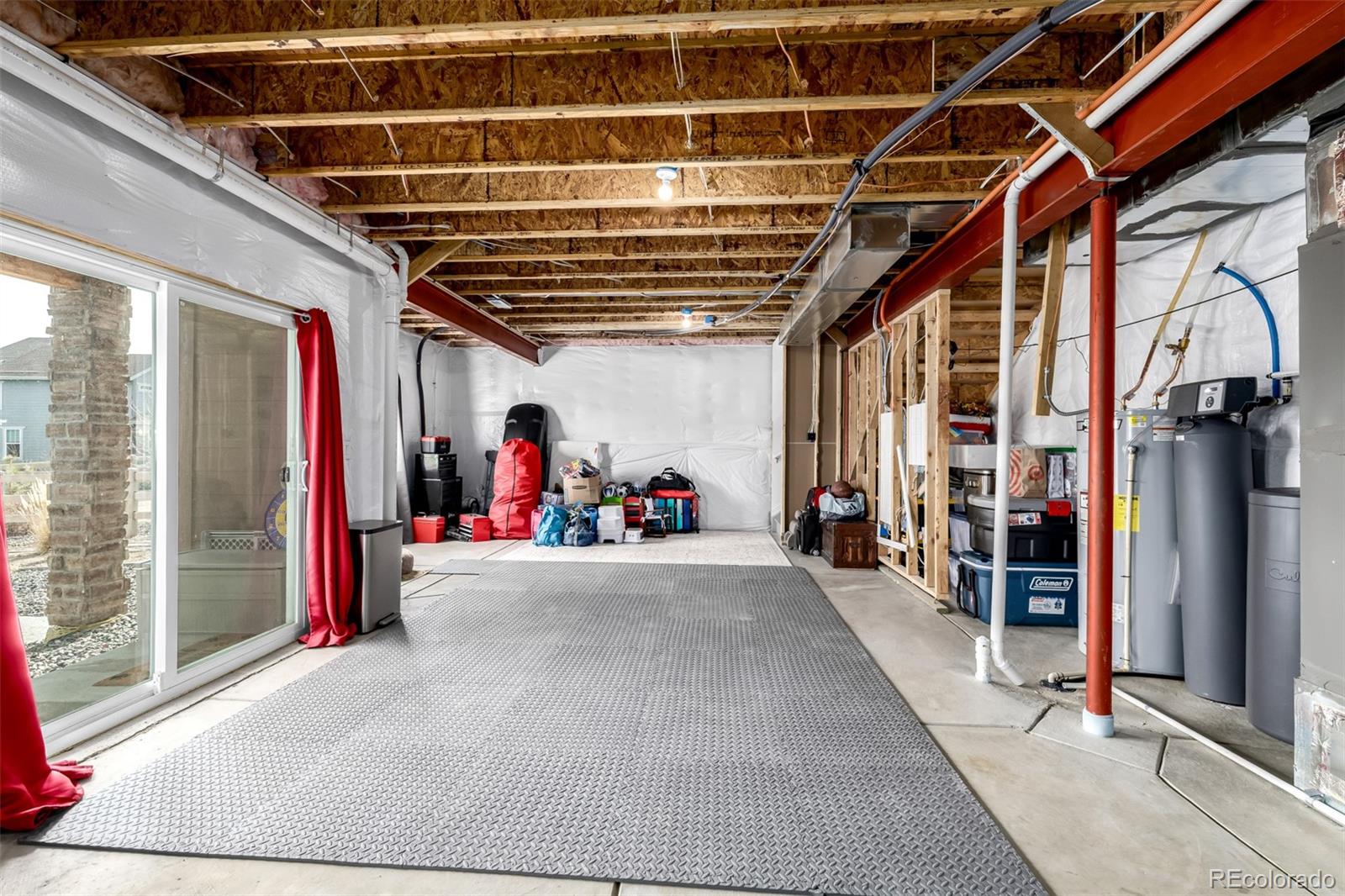 8184 Mt Lincoln Road Littleton, CO 80125 - Photo 37 of 46 a view of a garage with rack and furniture