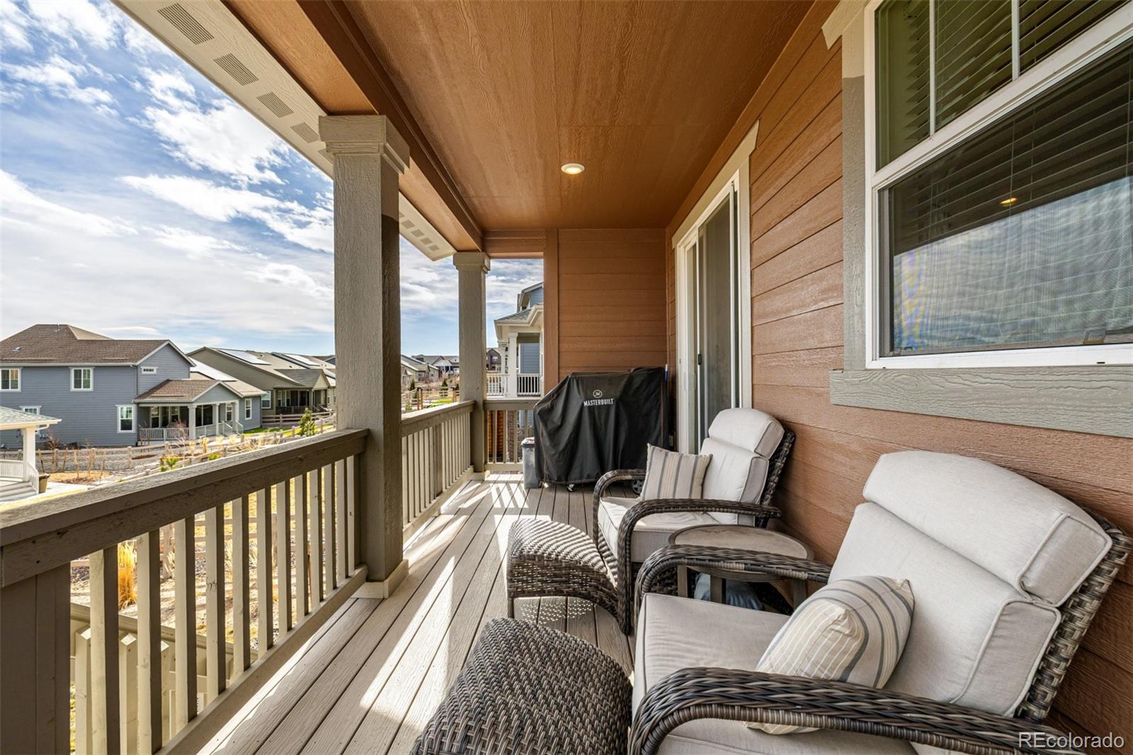 8184 Mt Lincoln Road Littleton, CO 80125 - Photo 40 of 46 a balcony view with a large window and furniture
