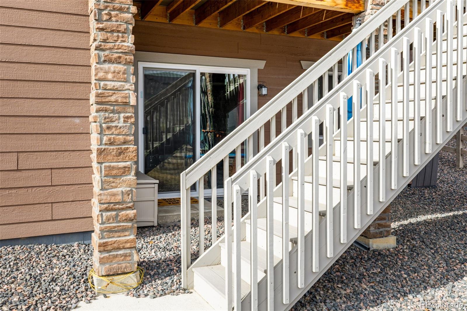 8184 Mt Lincoln Road Littleton, CO 80125 - Photo 42 of 46 a view of staircase with wooden floor and stairs
