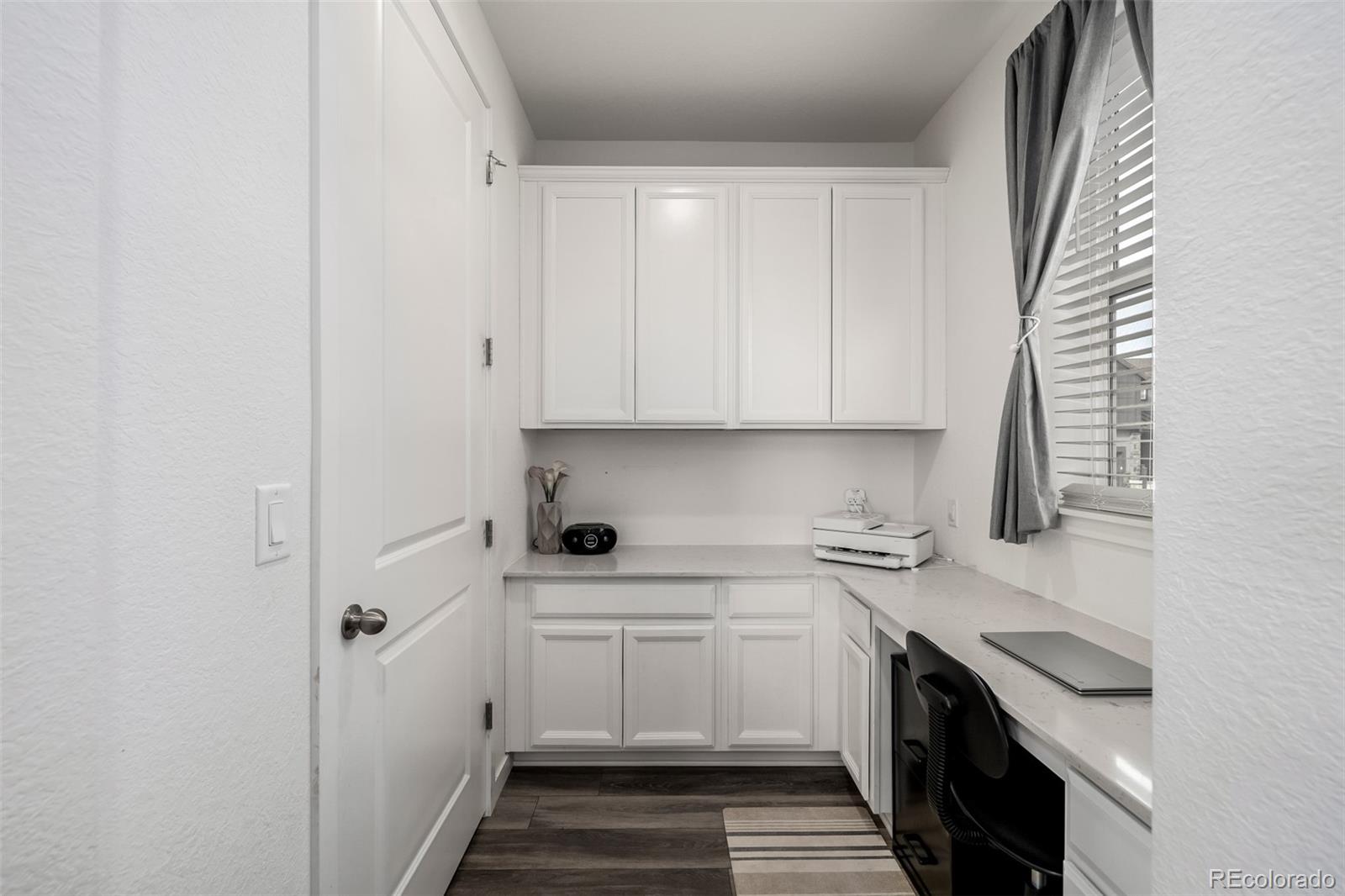 8184 Mt Lincoln Road Littleton, CO 80125 - Photo 7 of 46 a kitchen with a sink and cabinets