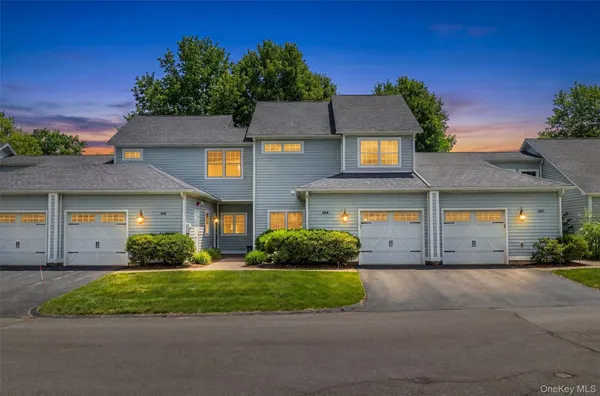 a view of a big house with a yard