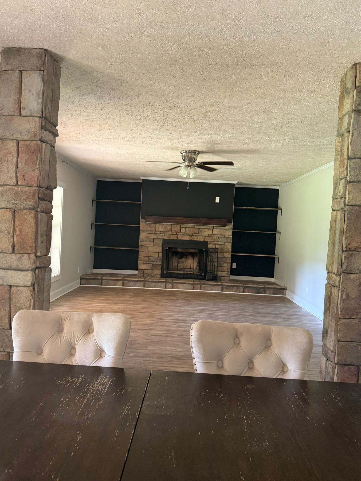 4920 Youngville Road Springfield, TN 37172 - Photo 19 of 54 a view of kitchen with kitchen island a sink and a fireplace