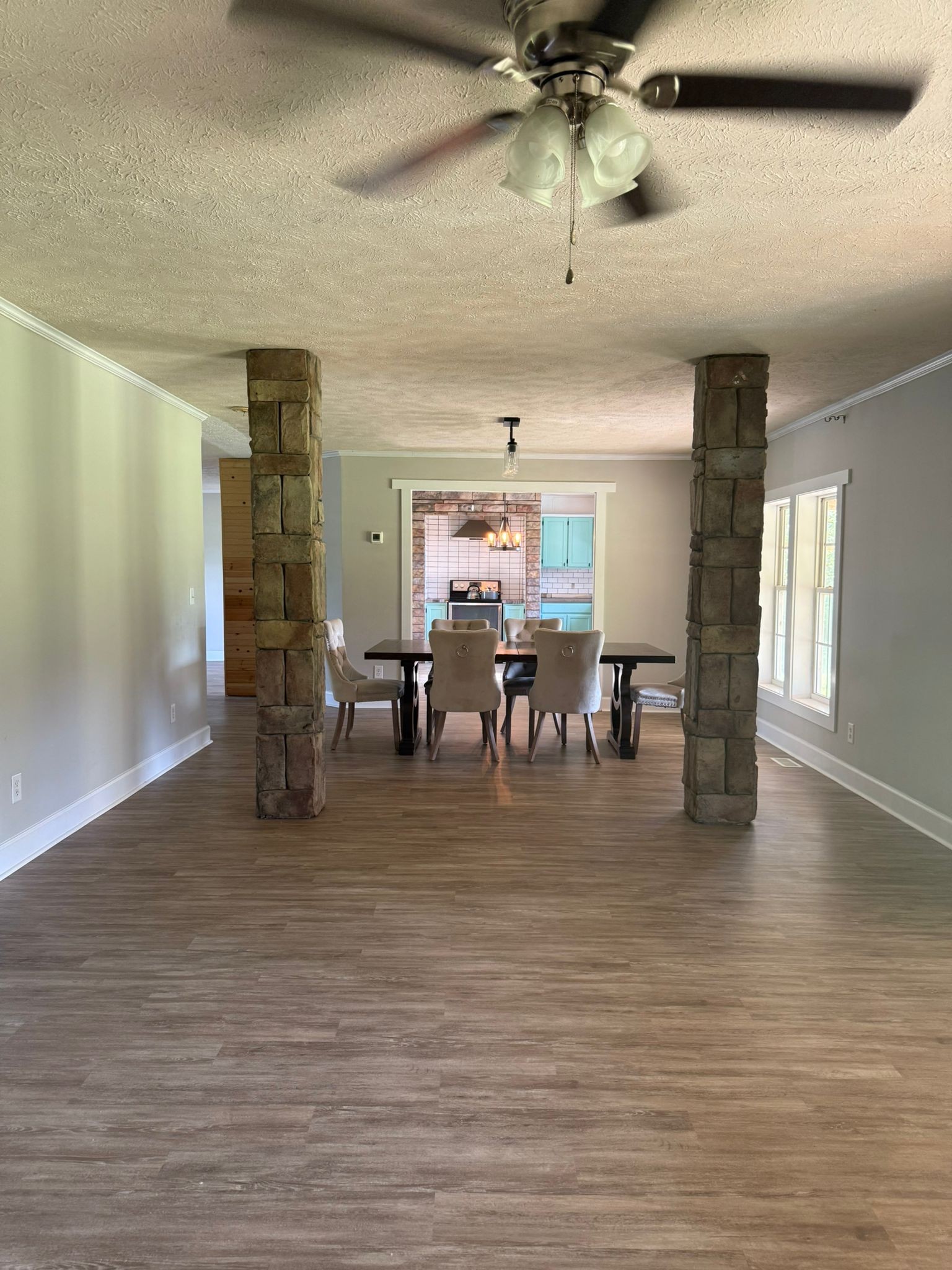 4920 Youngville Road Springfield, TN 37172 - Photo 26 of 54 a dining room with furniture a chandelier and wooden floor